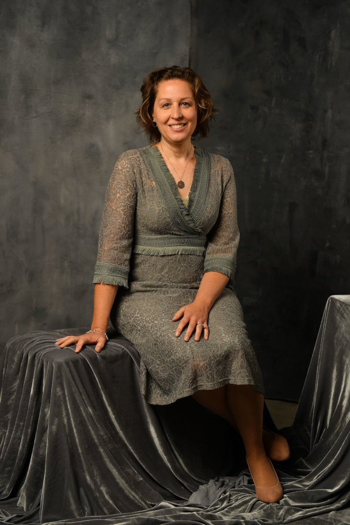 MBC Board member Vesna posing in a grey dress