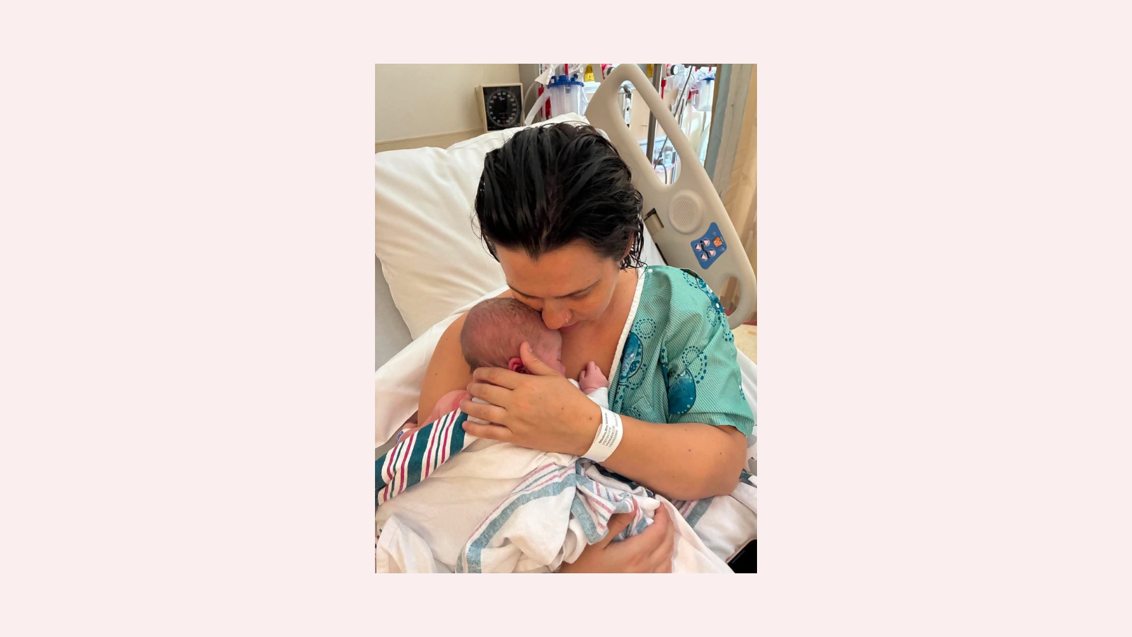 Debbie's daughter holding her new born